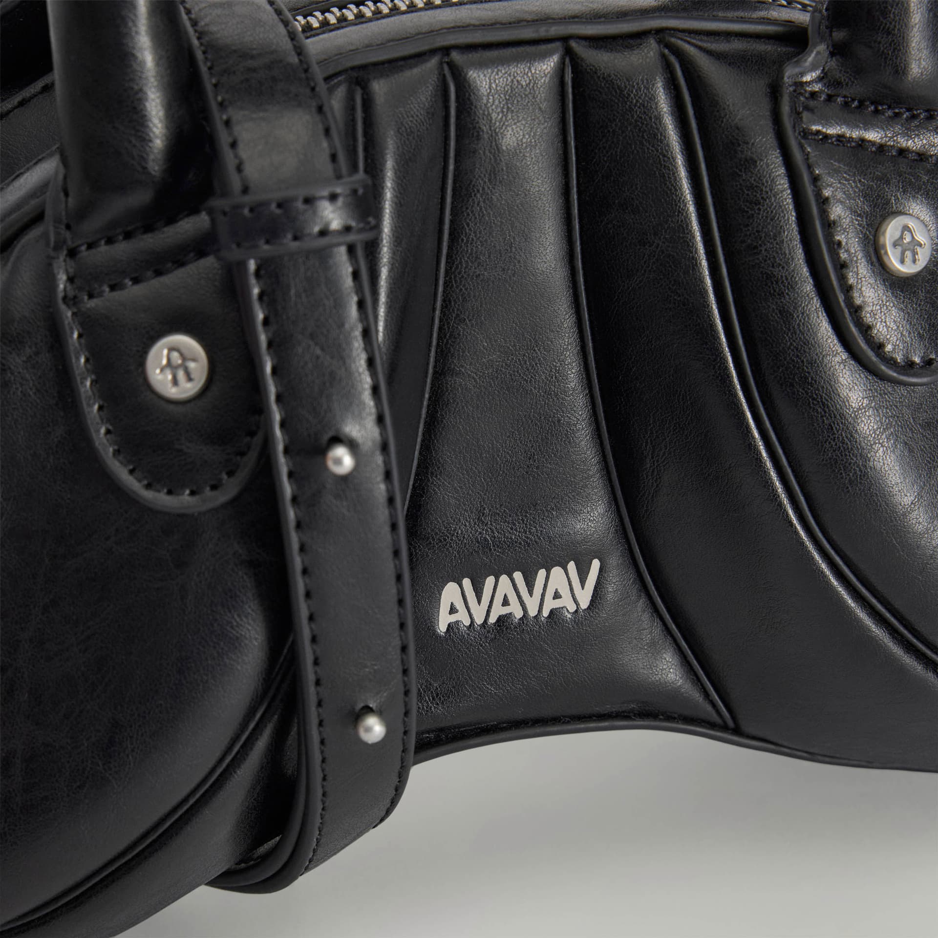 Close-up of the adidas Originals by Avavav PU Sculpted Bag Mini in black, showing the silver AVAVAV logo and stud details.